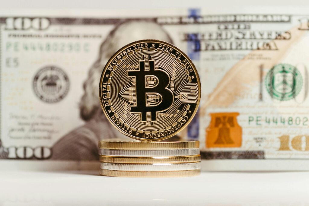 The image of the Bitcoin coin and dollar bill.